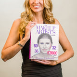 Woman holding a book titled 'The Makeup Artists' Design with a cover featuring a woman's face.
