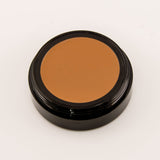 Brown makeup compact on a white background