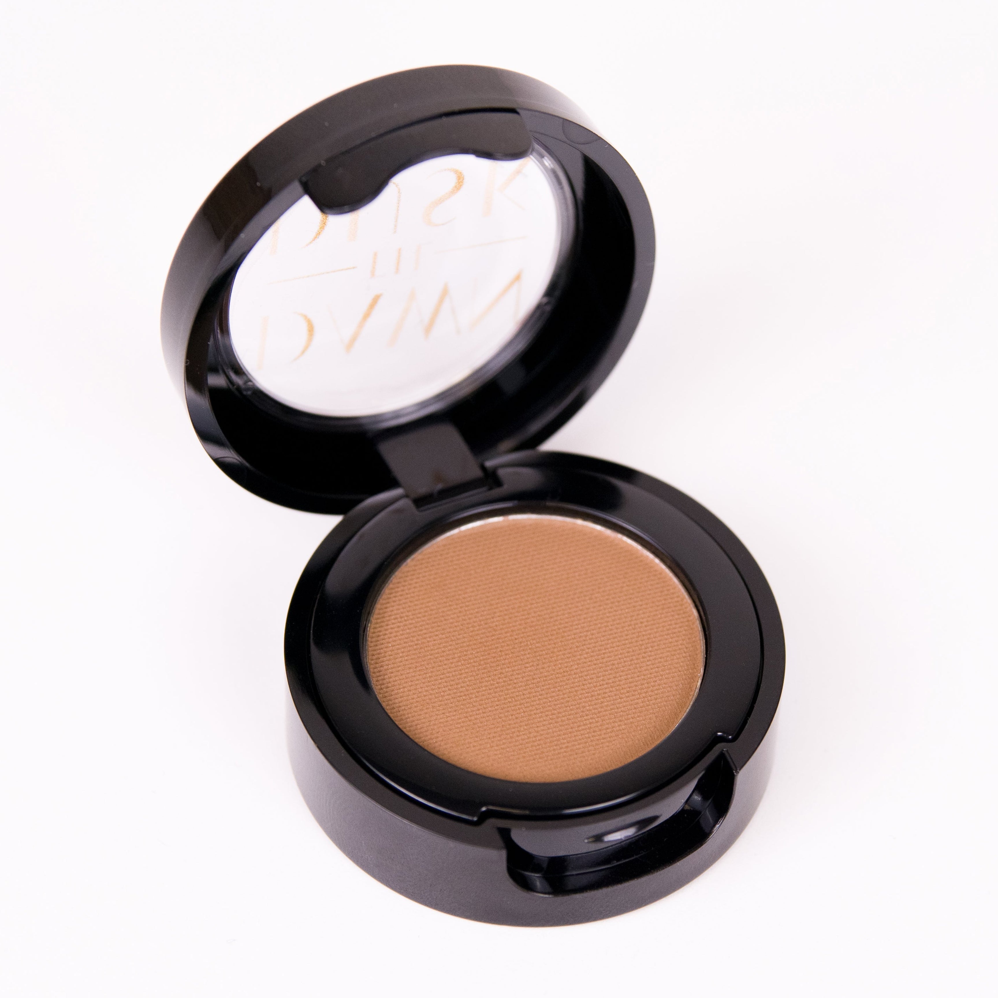 Compact powder in an open case on a white background