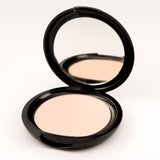 Compact powder with mirror on a white background