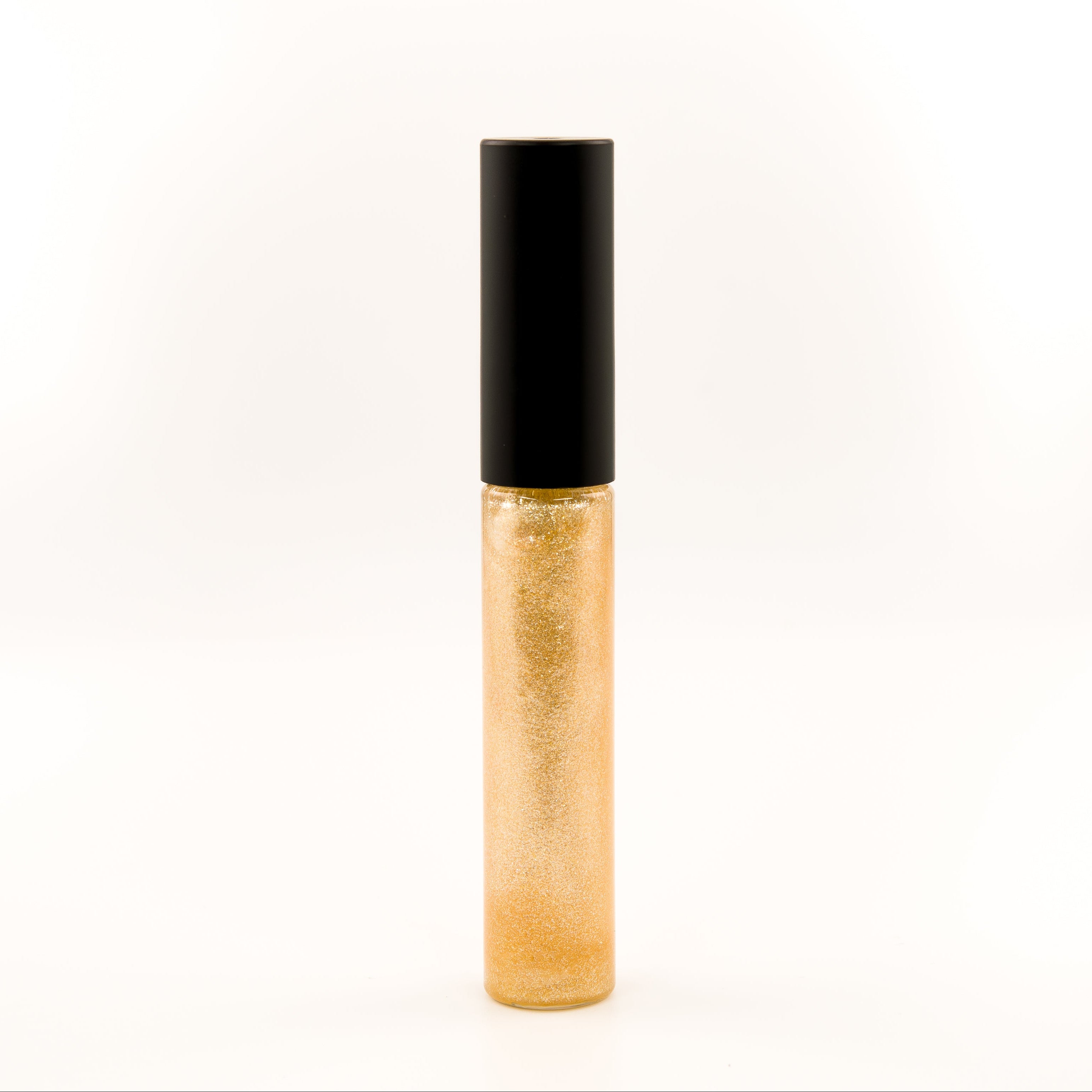 A single tube of gold glitter lip gloss or liquid lipstick with a black cap, standing upright against a plain white background.
