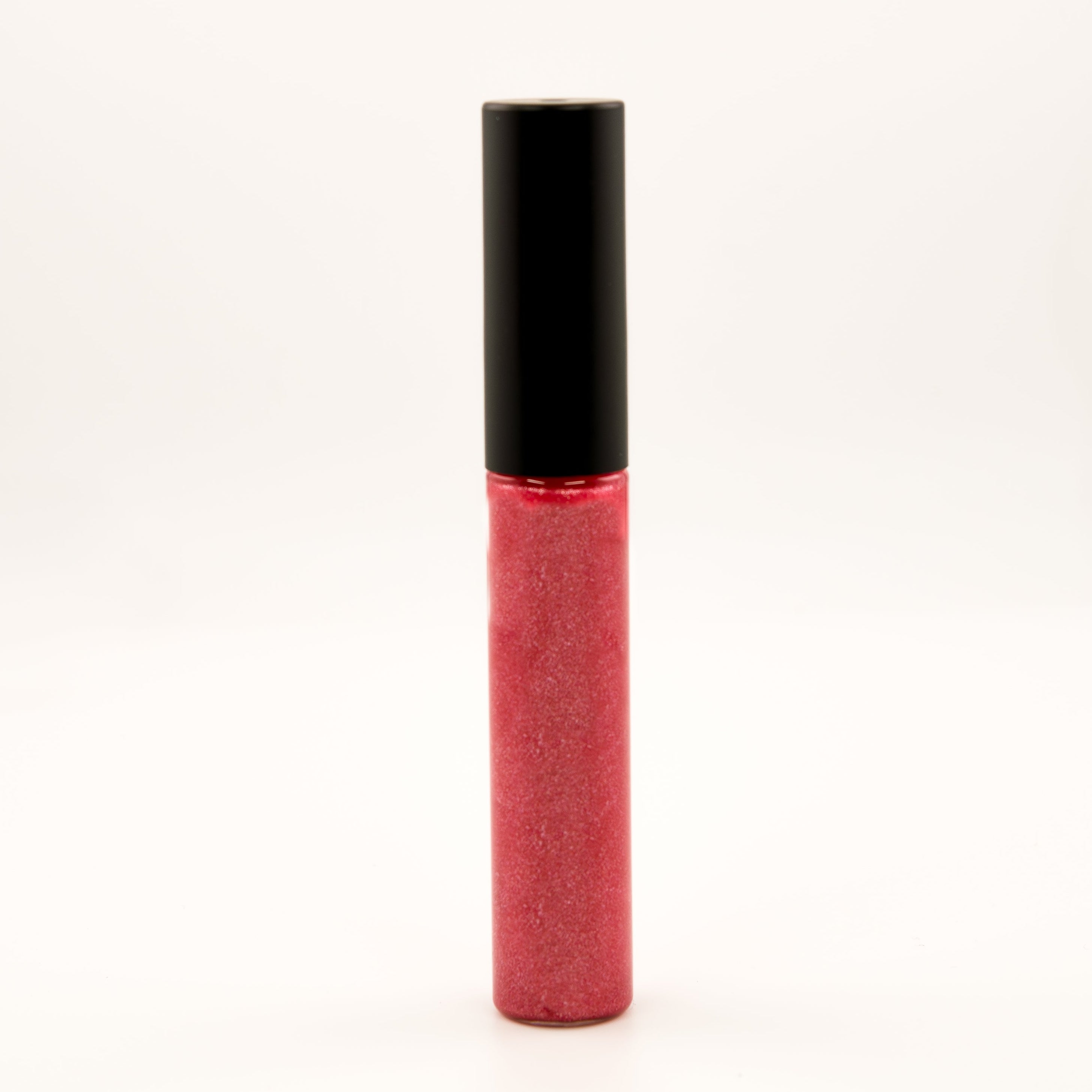A tube of glittery pink-red lip gloss or liquid lipstick with a black cap, standing upright on a plain white background.