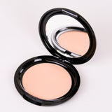 Compact powder in an open case on a white background